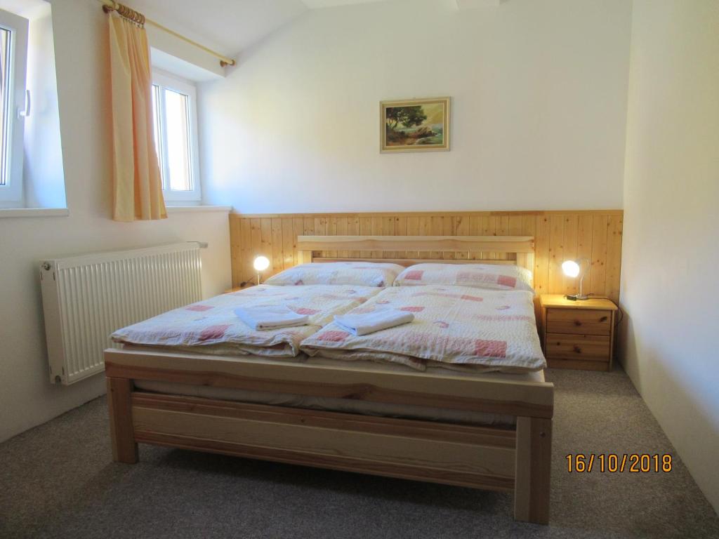 Postel nebo postele na pokoji v ubytování Guest House U Marie