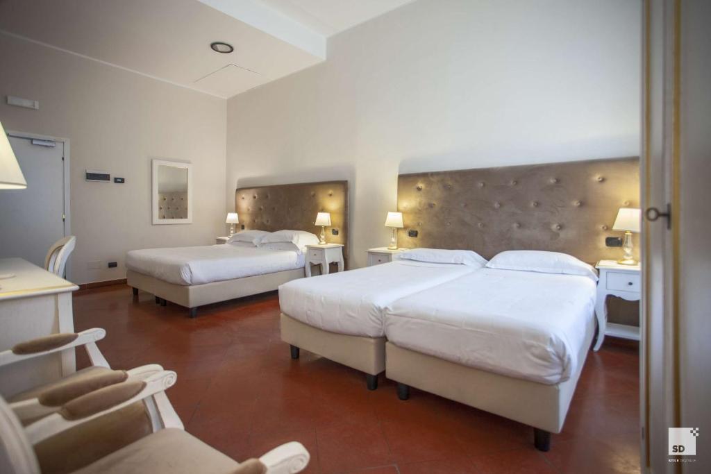 A bed or beds in a room at Palazzo Galletti Abbiosi