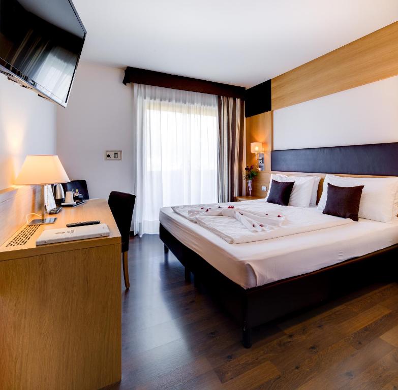 Postel nebo postele na pokoji v ubytování Best Western Hotel Adige