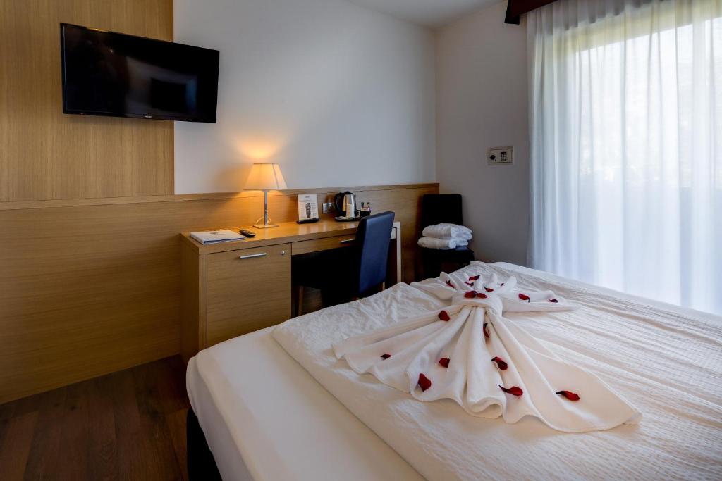 Postel nebo postele na pokoji v ubytování Best Western Hotel Adige