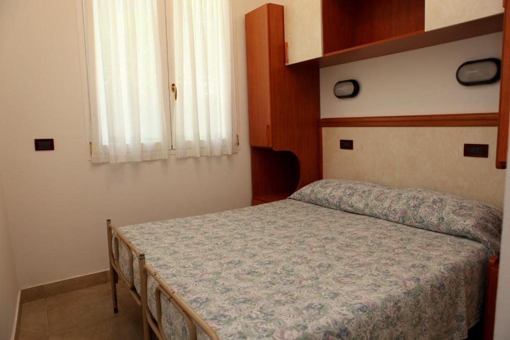 Postel nebo postele na pokoji v ubytování Hotel Parigi