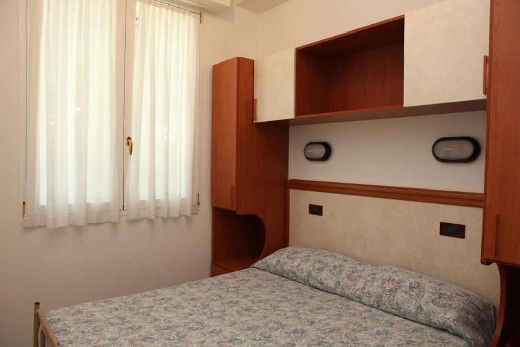 Postel nebo postele na pokoji v ubytování Hotel Parigi