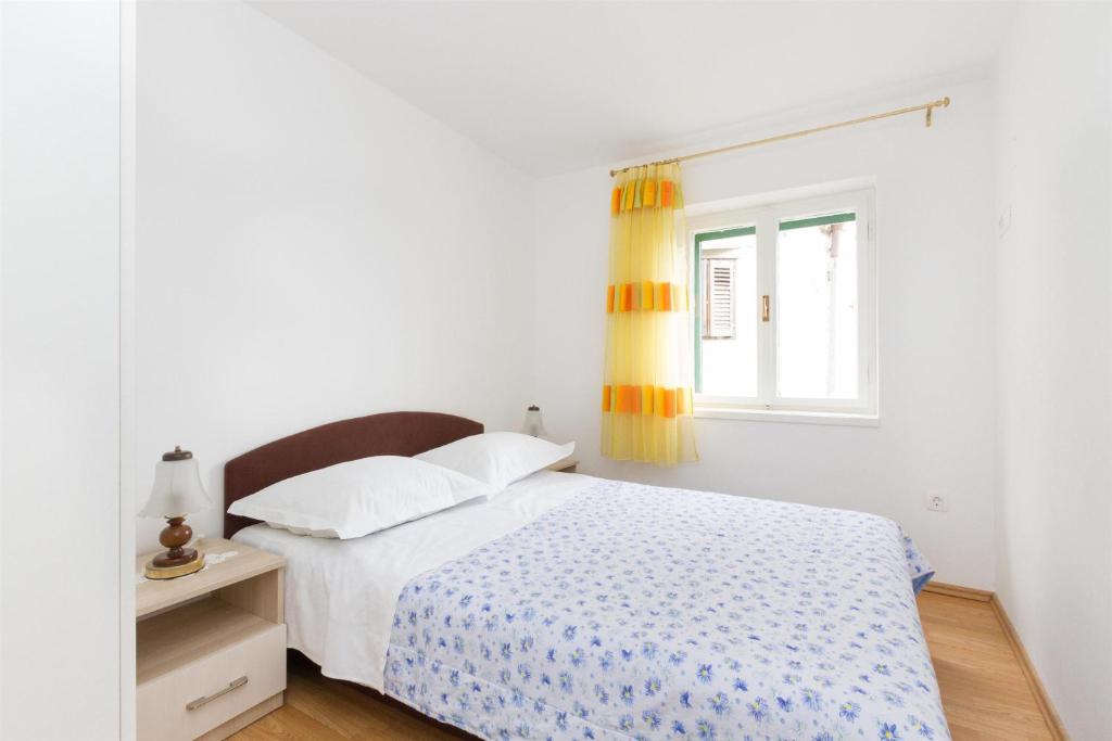 Posteľ alebo postele v izbe v ubytovaní Apartments Varos