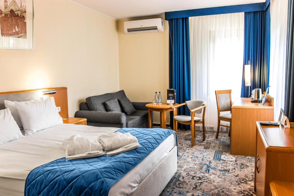 Posteľ alebo postele v izbe v ubytovaní Hotel Mrągowo Resort&Spa