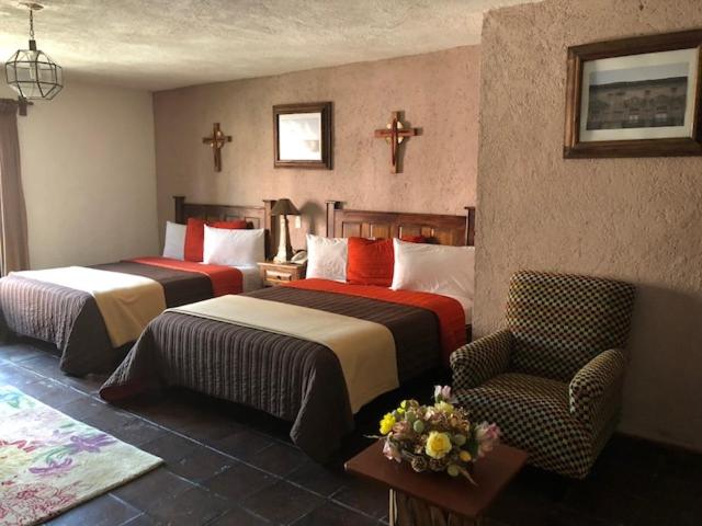 Postel nebo postele na pokoji v ubytování Hotel Refugio Victoria