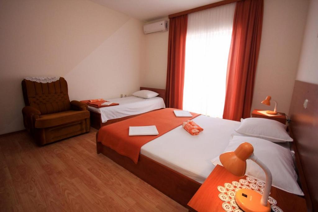Postel nebo postele na pokoji v ubytování Apartments Duki
