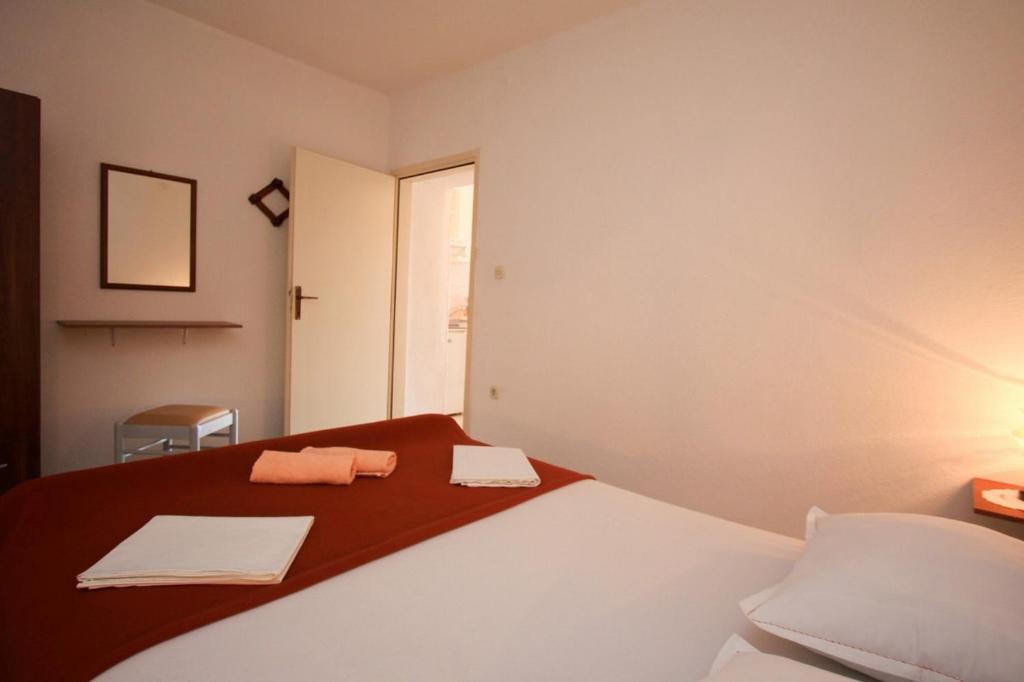 Postel nebo postele na pokoji v ubytování Apartments Duki