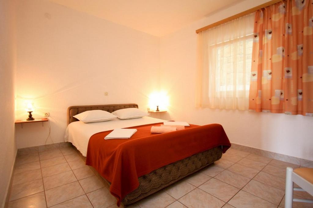 Postel nebo postele na pokoji v ubytování Apartments Duki
