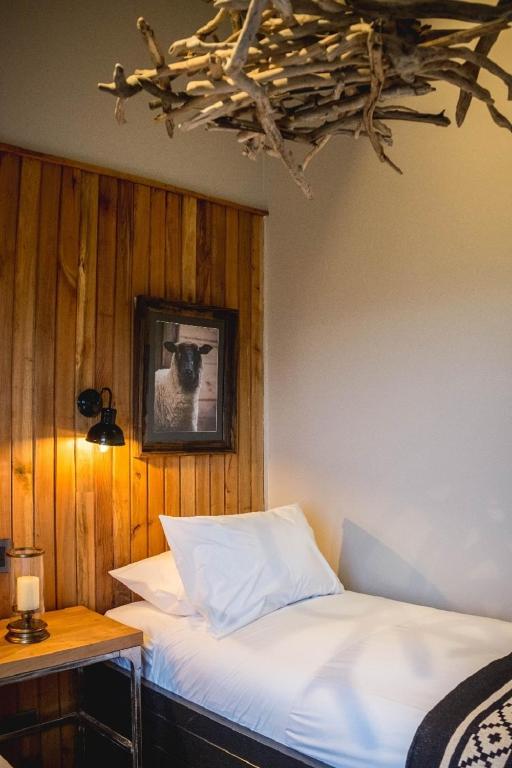 Postel nebo postele na pokoji v ubytování Hostal Boutique Factoria Patagonia