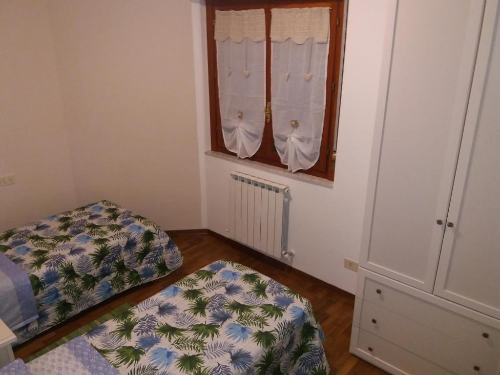A bed or beds in a room at Casa Vacanze "Ai piedi di Assisi"