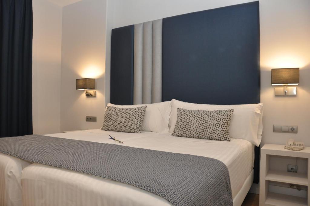 Postel nebo postele na pokoji v ubytování Hotel Selu