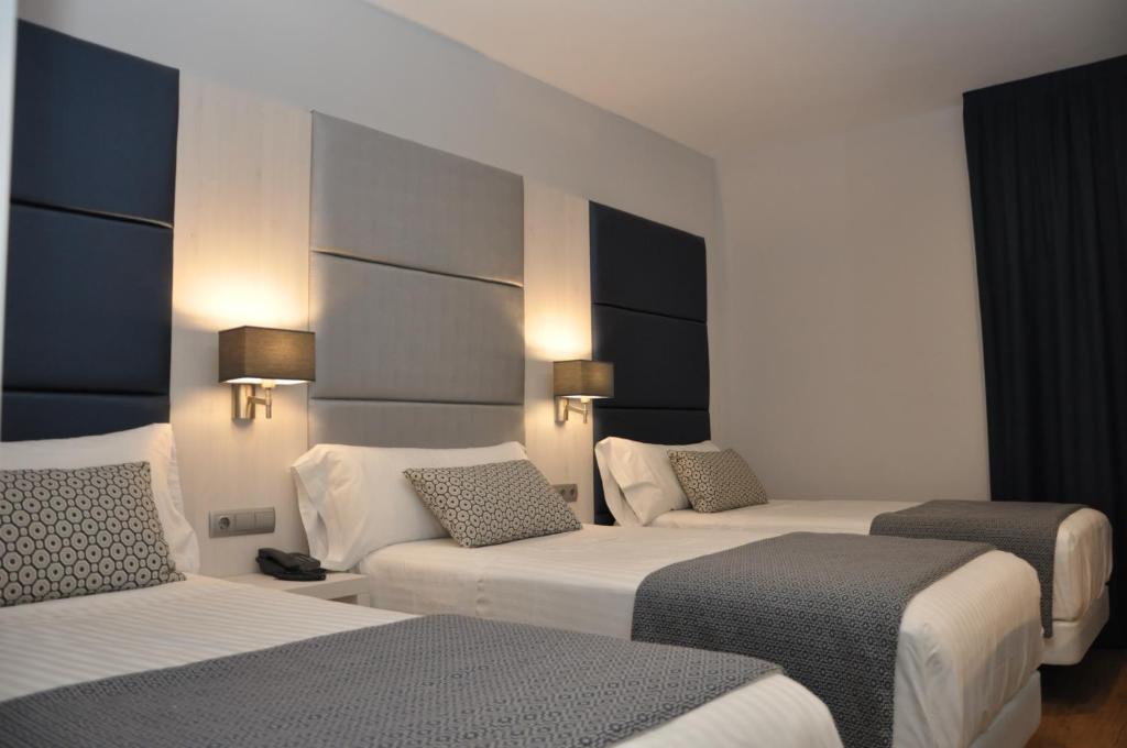 Postel nebo postele na pokoji v ubytování Hotel Selu