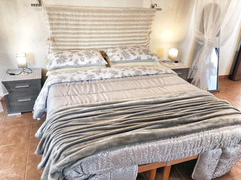 En eller flere senger på et rom på Trulli Caroli