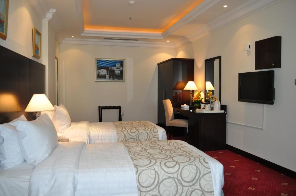 Postel nebo postele na pokoji v ubytování Musherib Hotel