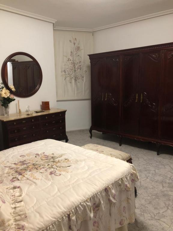 A bed or beds in a room at Peso de la Harina - piso completo
