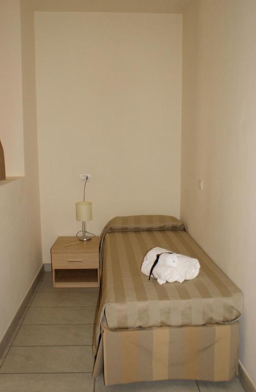 A bed or beds in a room at Residence Belmare