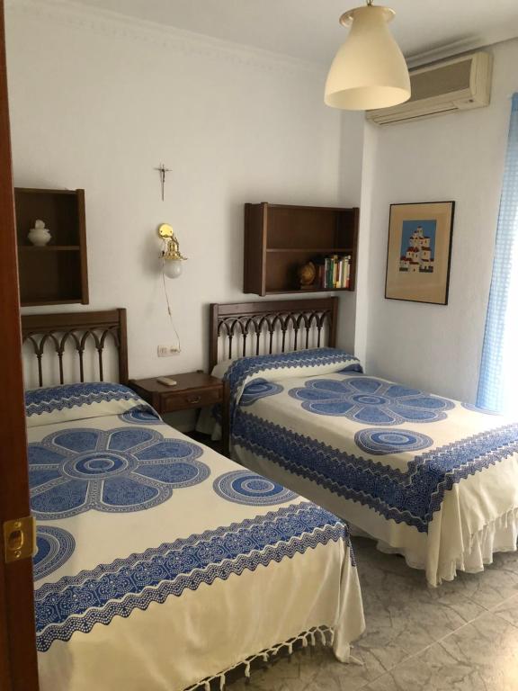 A bed or beds in a room at Peso de la Harina - piso completo