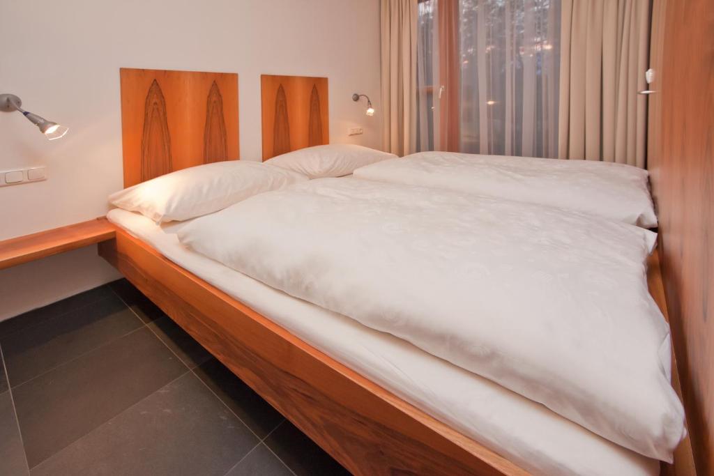 Posteľ alebo postele v izbe v ubytovaní Apartments Aeon