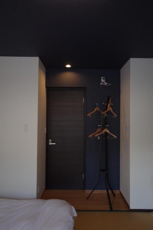 Postel nebo postele na pokoji v ubytování Cinnamon Guesthouse Dogo