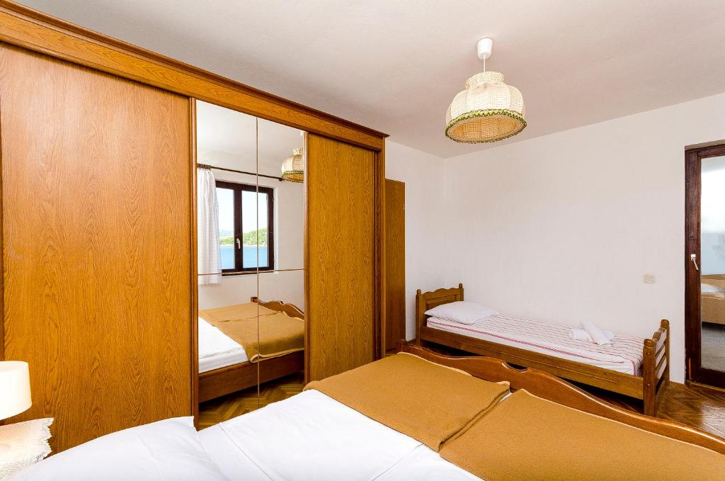 Posteľ alebo postele v izbe v ubytovaní Apartments Rozalija