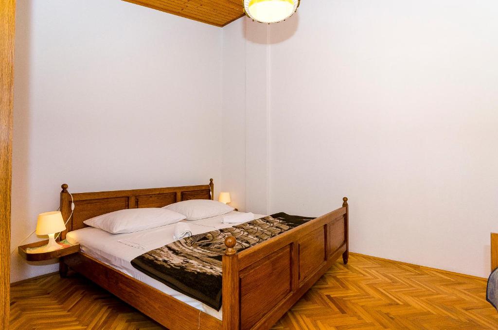Posteľ alebo postele v izbe v ubytovaní Apartments Rozalija