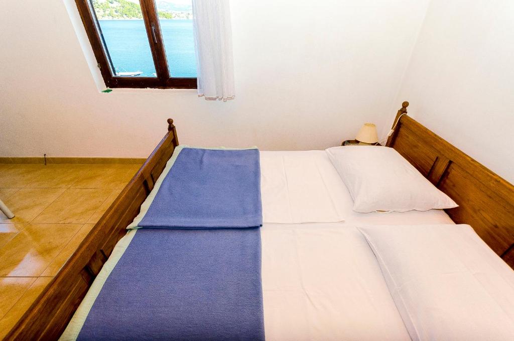 Posteľ alebo postele v izbe v ubytovaní Apartments Rozalija