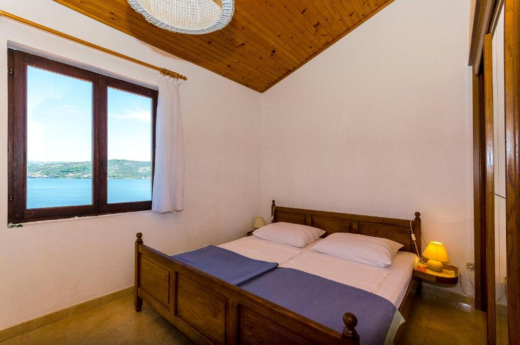 Posteľ alebo postele v izbe v ubytovaní Apartments Rozalija