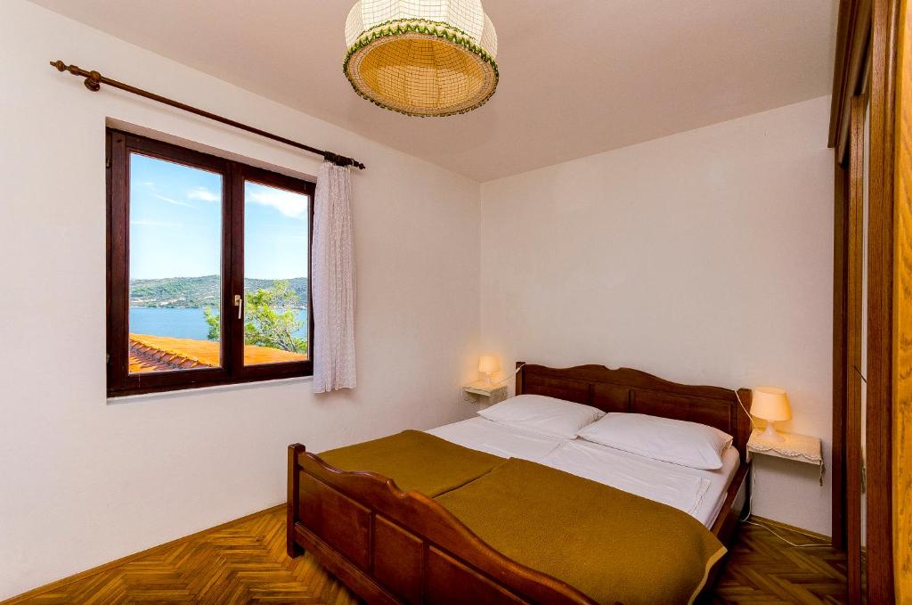 Posteľ alebo postele v izbe v ubytovaní Apartments Rozalija