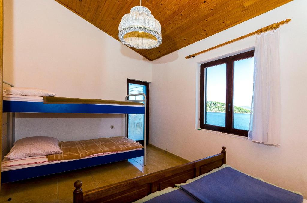 Posteľ alebo postele v izbe v ubytovaní Apartments Rozalija