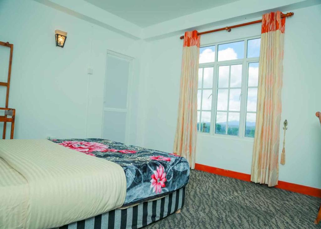 Postel nebo postele na pokoji v ubytování Namadi Nest home stay