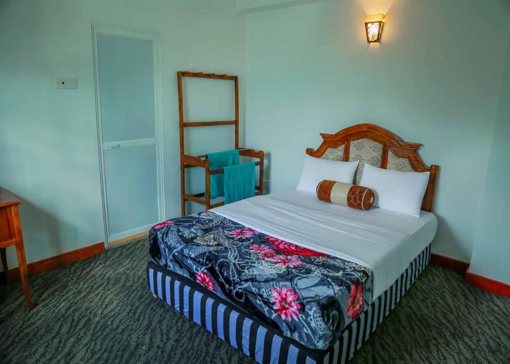 Postel nebo postele na pokoji v ubytování Namadi Nest home stay