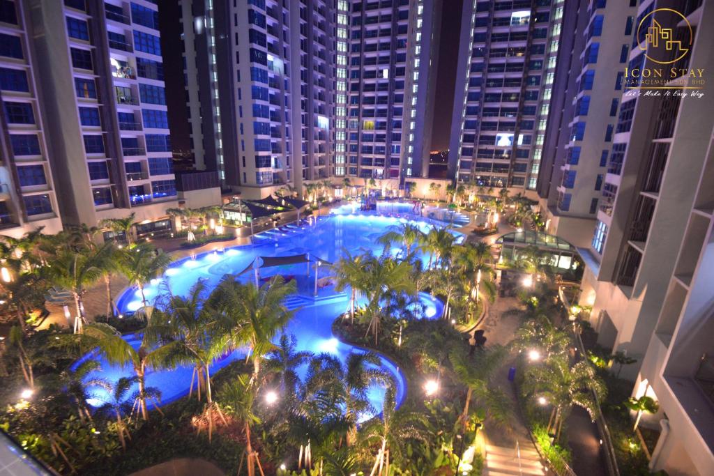 an overhead view of a pool at a hotel at night at Atlantis Residence @ Icon Stay Melaka in Malacca