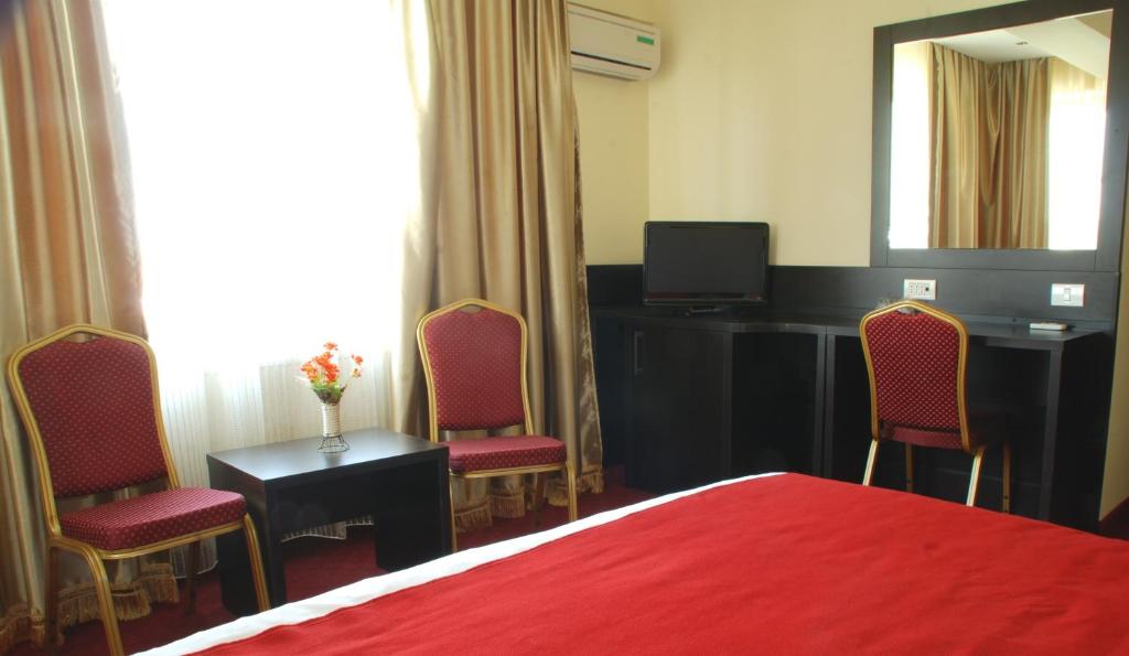 Postel nebo postele na pokoji v ubytování Hotel Ancor