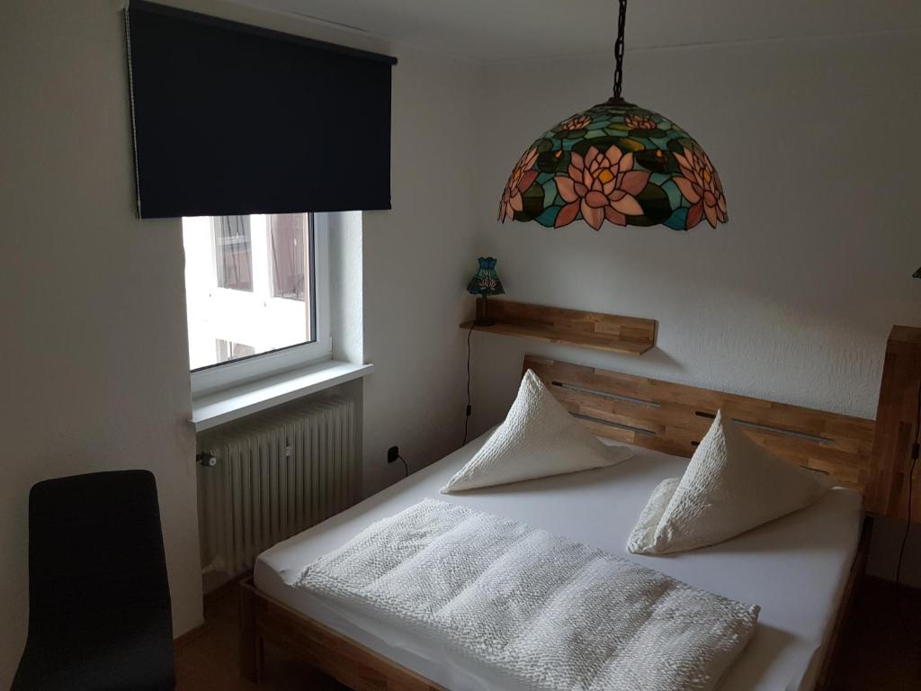 Postel nebo postele na pokoji v ubytování Hotel Zrenners GARNI