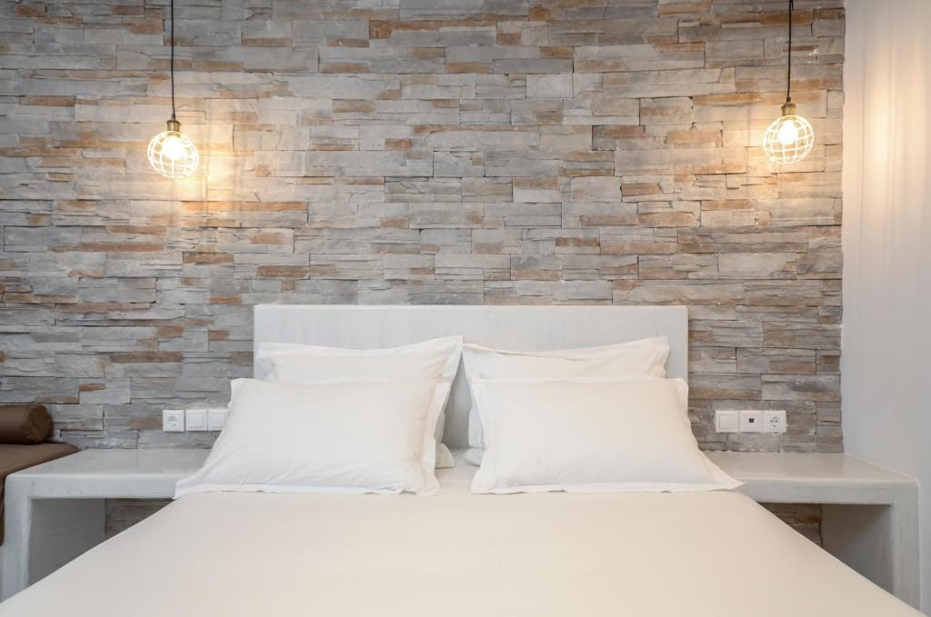 Postel nebo postele na pokoji v ubytování Dimitra Hotel