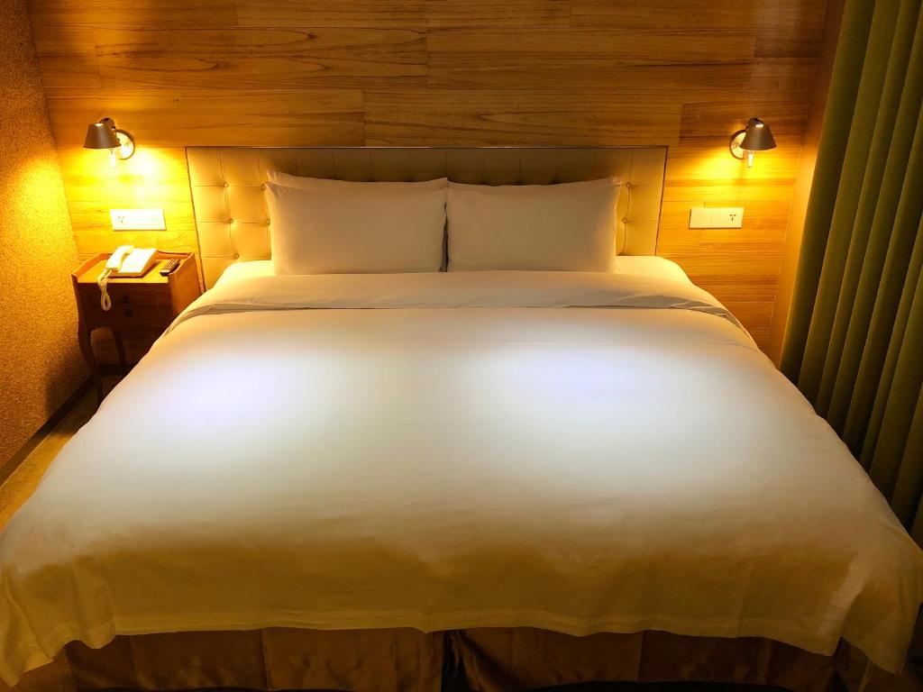 Postel nebo postele na pokoji v ubytování Inhouse Hotel Taichung