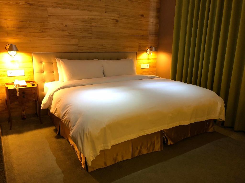 Postel nebo postele na pokoji v ubytování Inhouse Hotel Taichung
