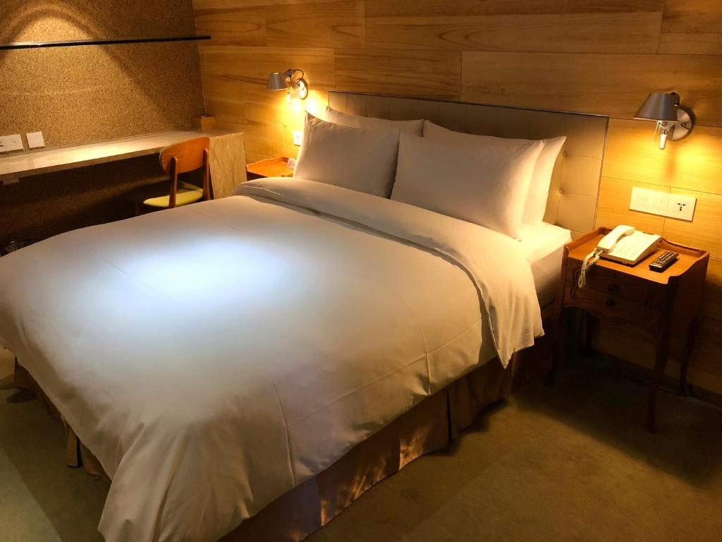 Postel nebo postele na pokoji v ubytování Inhouse Hotel Taichung