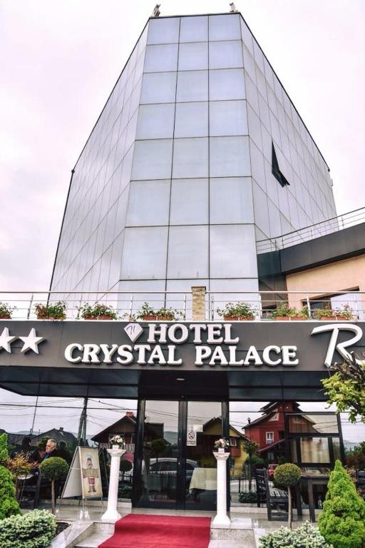a hotel civil palace sign in front of a building at Hotel Crystal Palace in Râmnicu Vâlcea