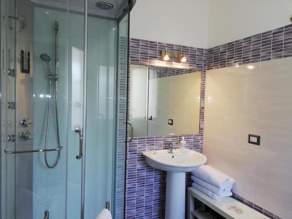 a bathroom with a sink and a shower at Akron B&B in SantʼAlessio Siculo