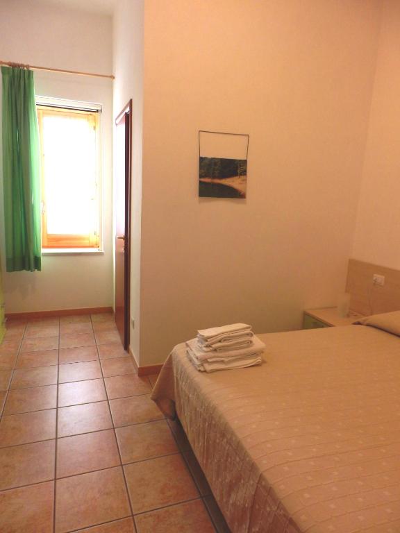 Postel nebo postele na pokoji v ubytování B&B Rose Villa