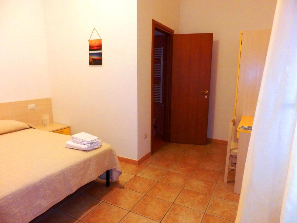 Postel nebo postele na pokoji v ubytování B&B Rose Villa