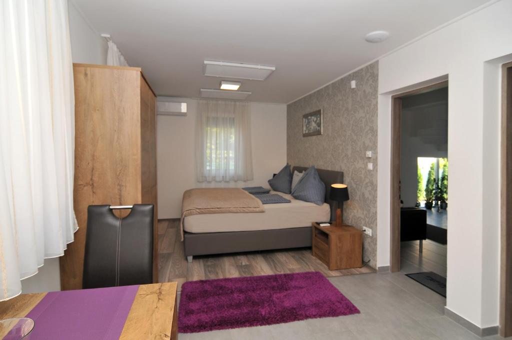 Posteľ alebo postele v izbe v ubytovaní Silver Beach Apartments