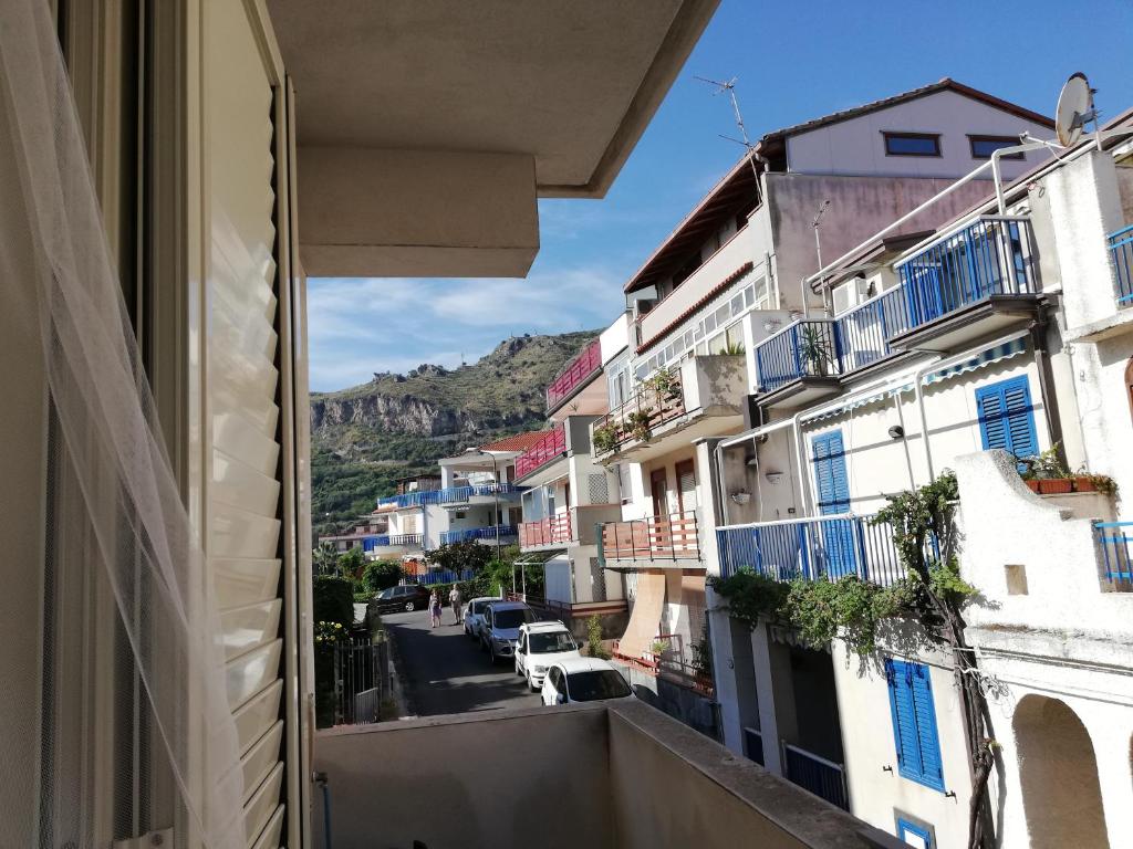 a view of a city street from a window at Akron B&B in SantʼAlessio Siculo