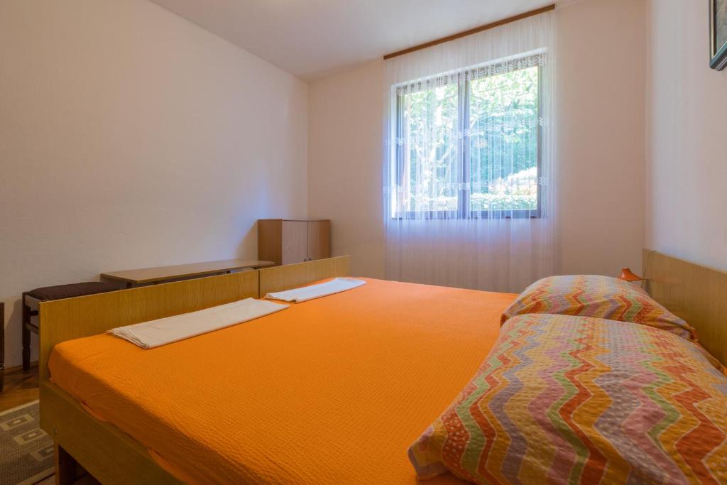 Postel nebo postele na pokoji v ubytování APARTMAN VERA