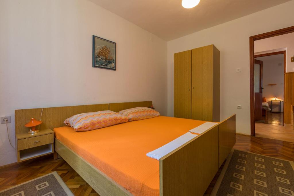 Postel nebo postele na pokoji v ubytování APARTMAN VERA
