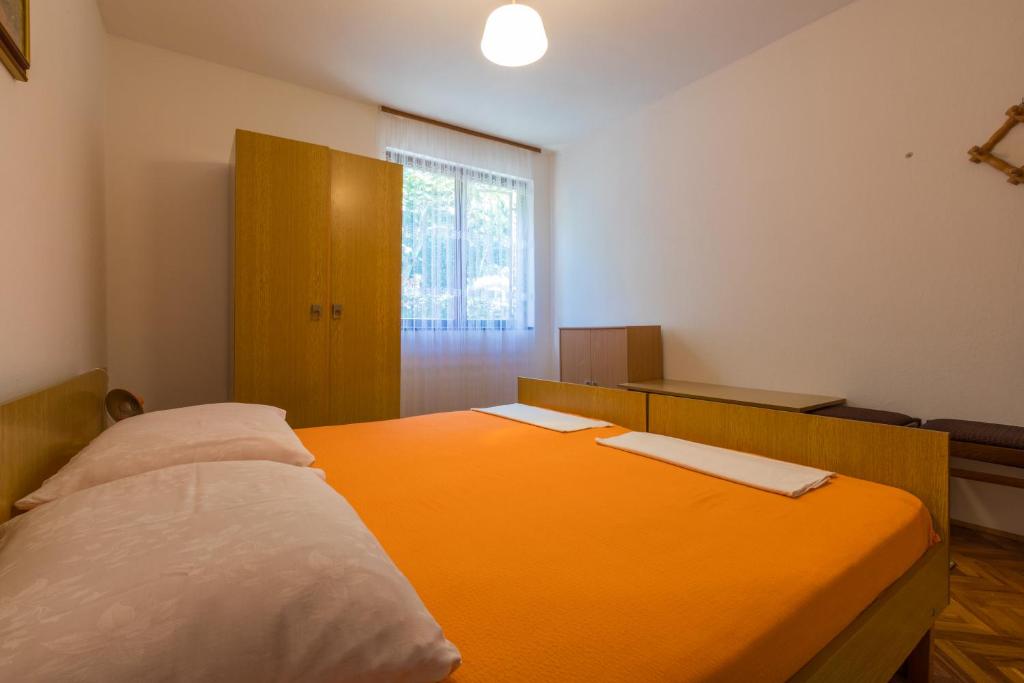 Postel nebo postele na pokoji v ubytování APARTMAN VERA