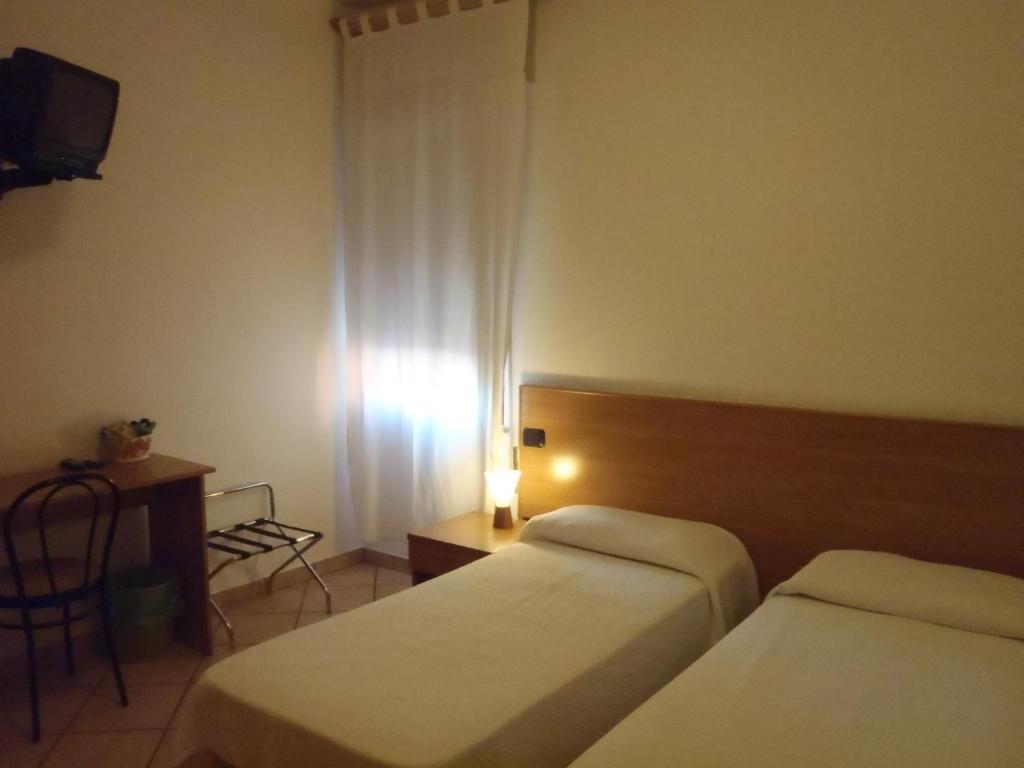 Postel nebo postele na pokoji v ubytování Albergo Pizzeria Sole
