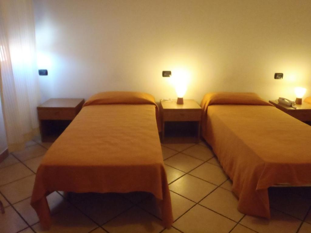 Postel nebo postele na pokoji v ubytování Albergo Pizzeria Sole