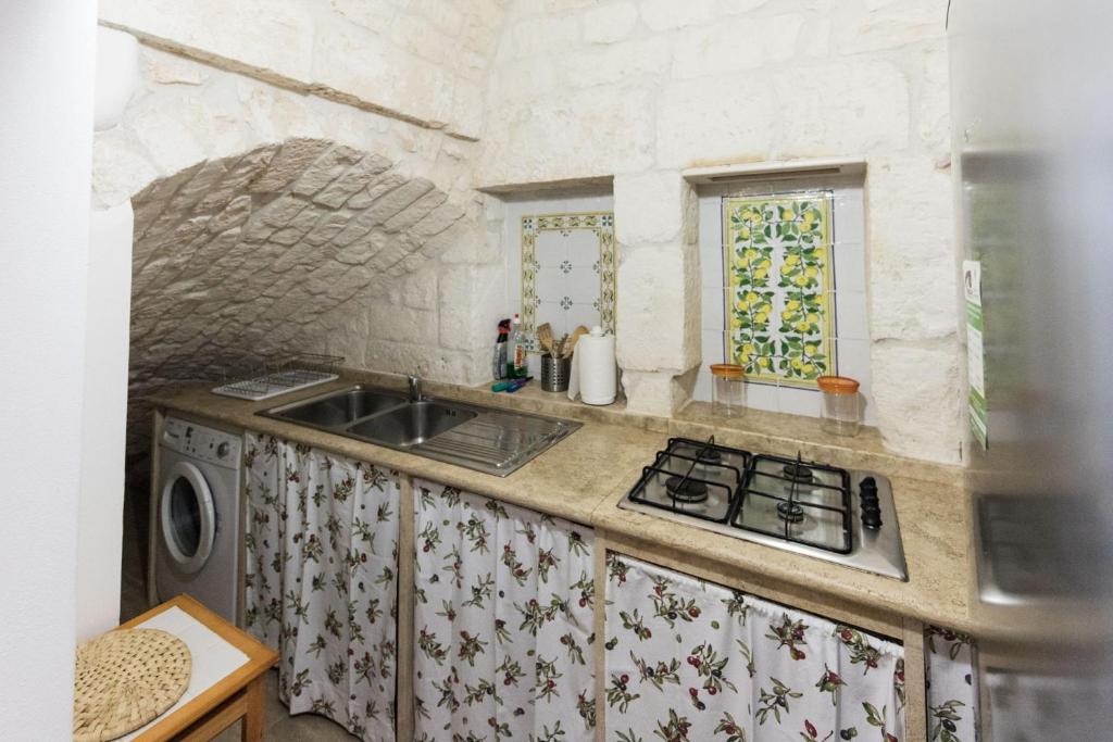 Una cocina o zona de cocina en Le Piccole Case Bianche